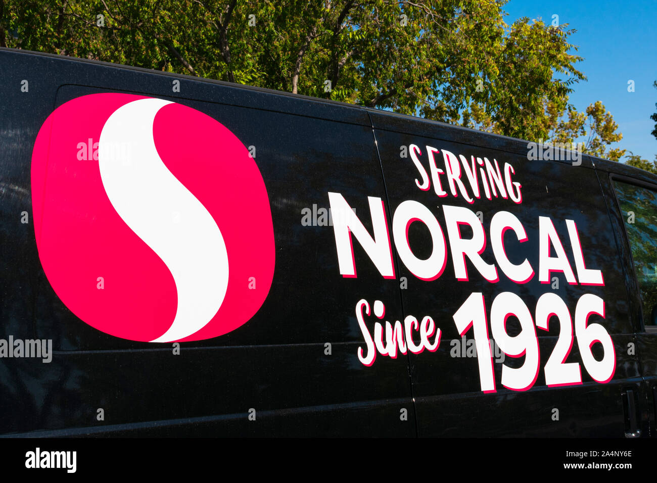 Safeway logo and slogan ‘Serving Northern California since 1926’ on the side of black Chevrolet van Stock Photo