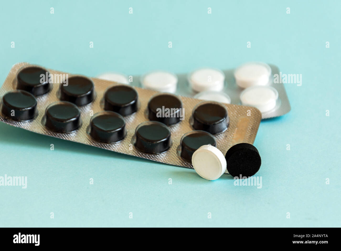 Medical pills in a plastic transparent container on pastel color table background. Antibiotic treatment therapy. Doctor's prescription. Stock Photo