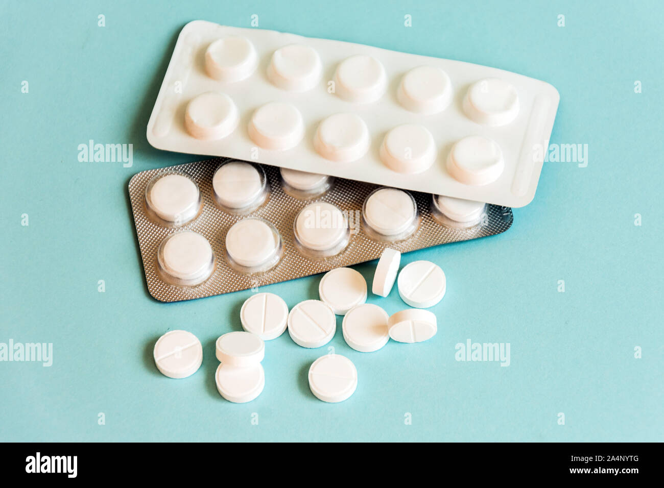 Medical pills in a plastic transparent container on pastel color table background. Antibiotic treatment therapy. Doctor's prescription. Stock Photo