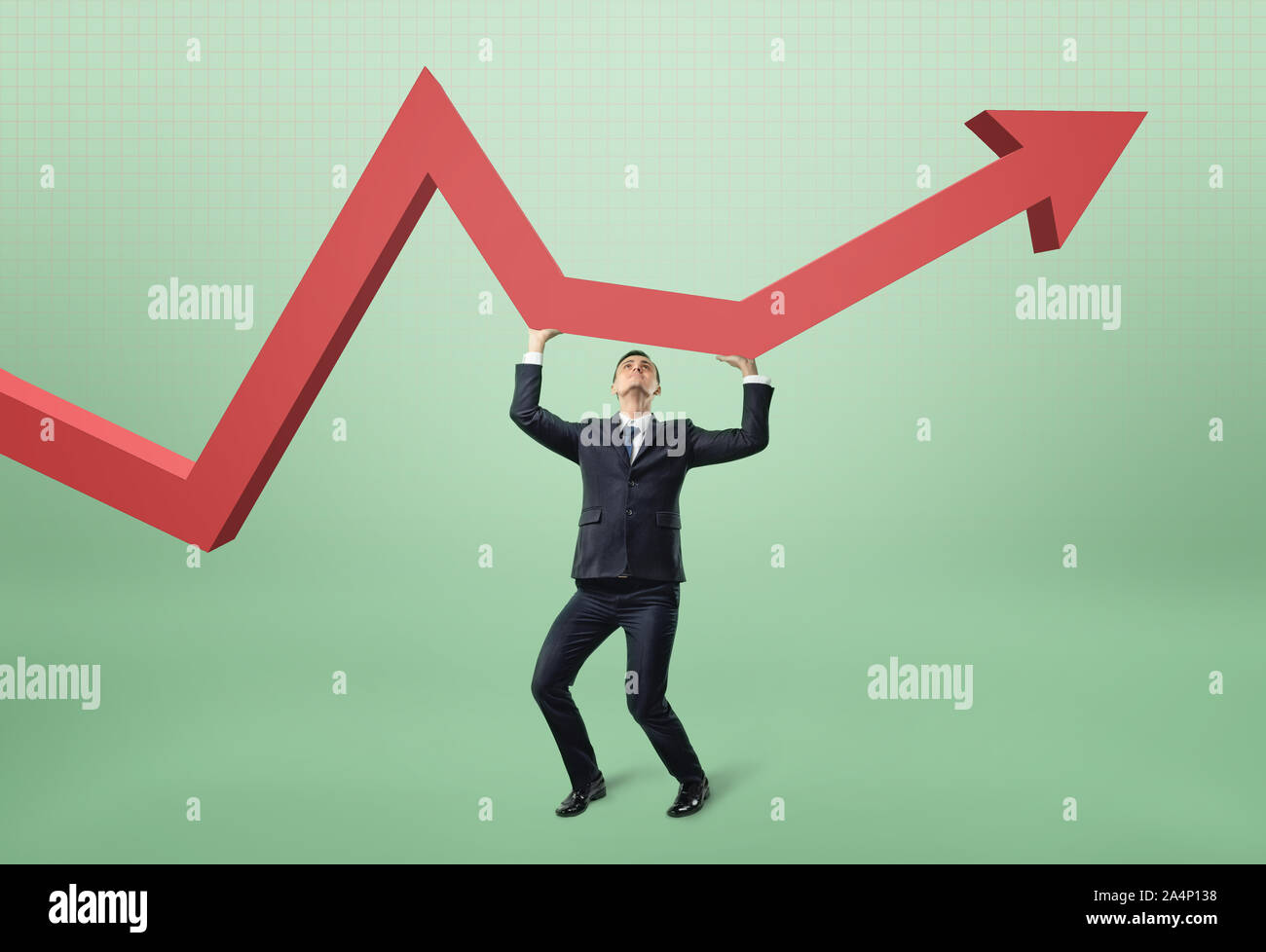 Businessman lifts red arrow up. Stock Photo