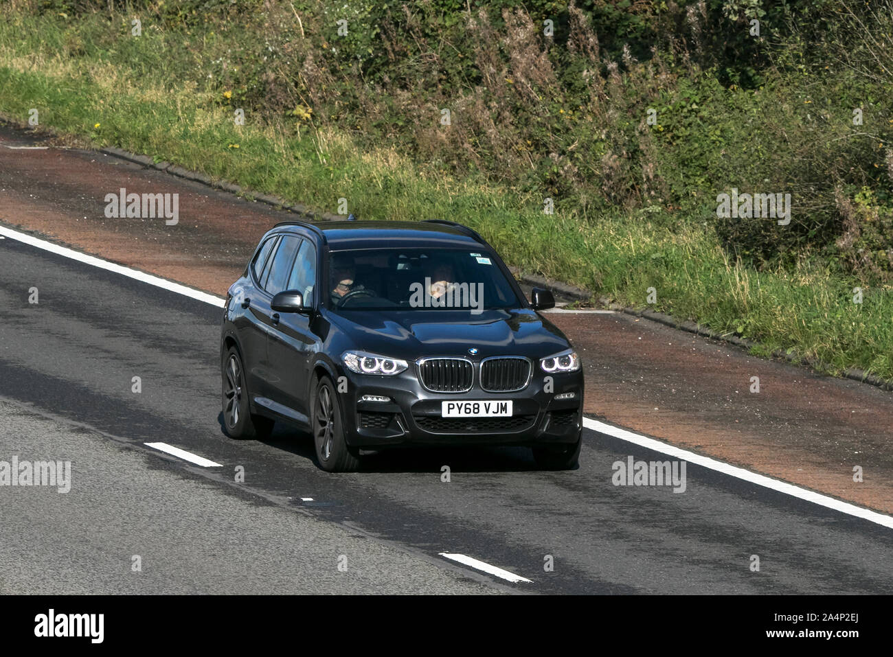 2019 grey BMW X3 Xdrive20D M Sport Auto; traveling on the M6 motorway near Preston in Lancashire, UK Stock Photo