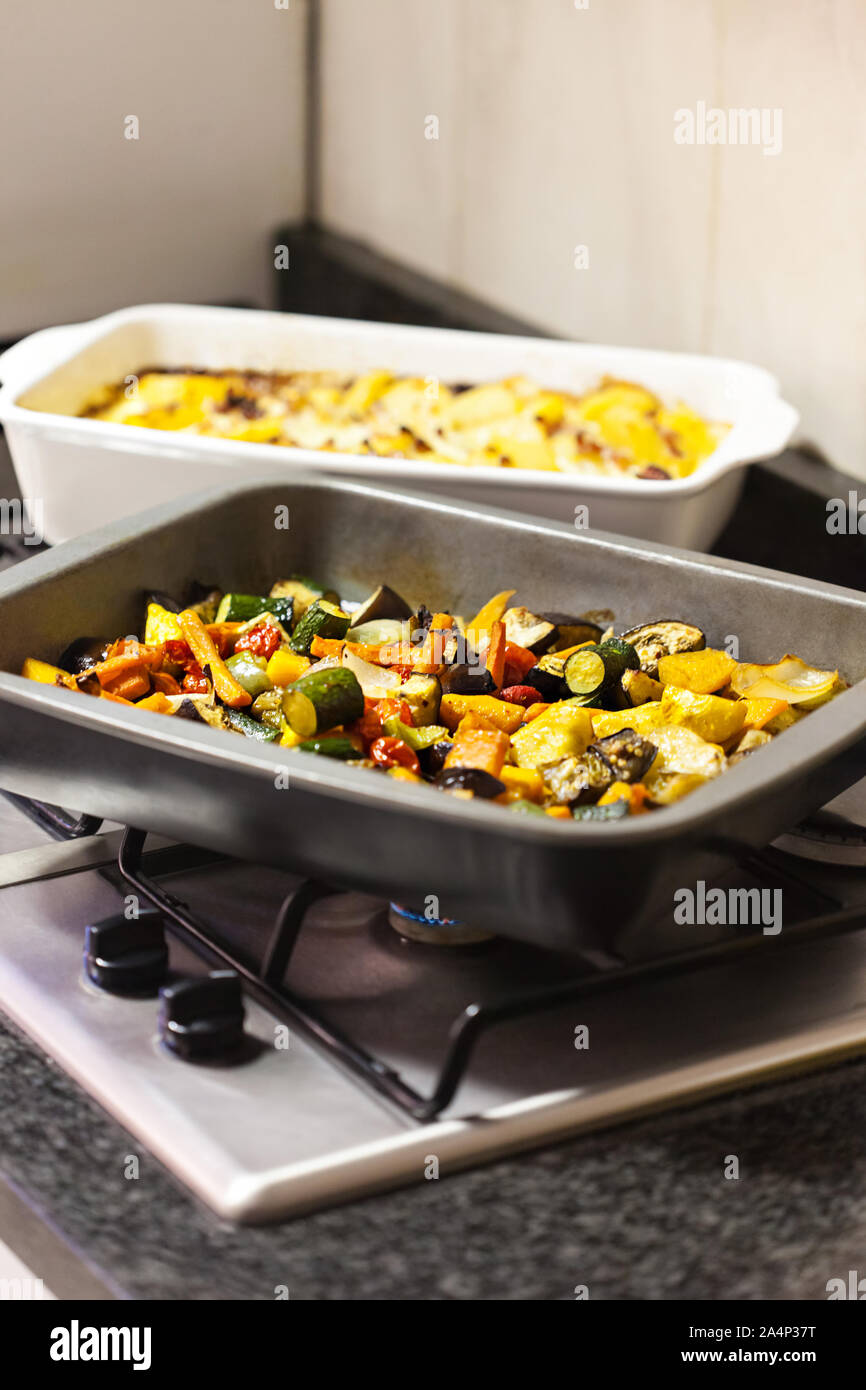 warming baked home cooked vegetables on the gas stove Stock Photo Alamy