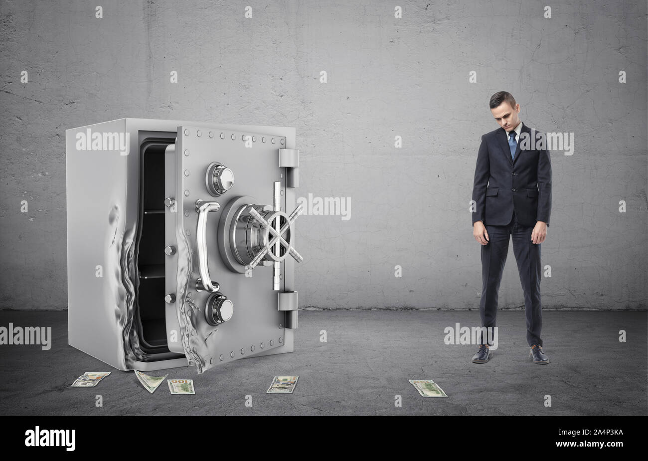 Safe with its door broken open and disappointed businessman full height Stock Photo