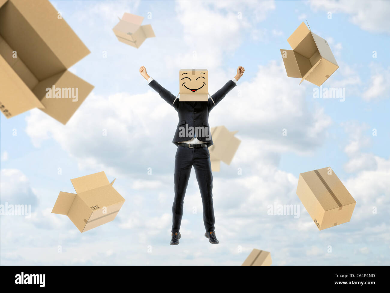 Businessman wears box on his head with funny face, lifts hands up and