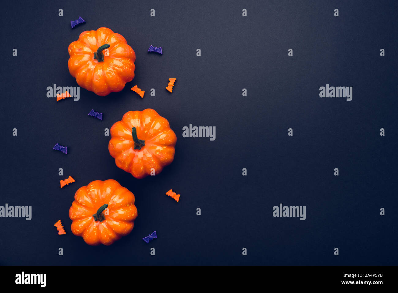 Halloween holiday background with pumpkins and bats Stock Photo - Alamy
