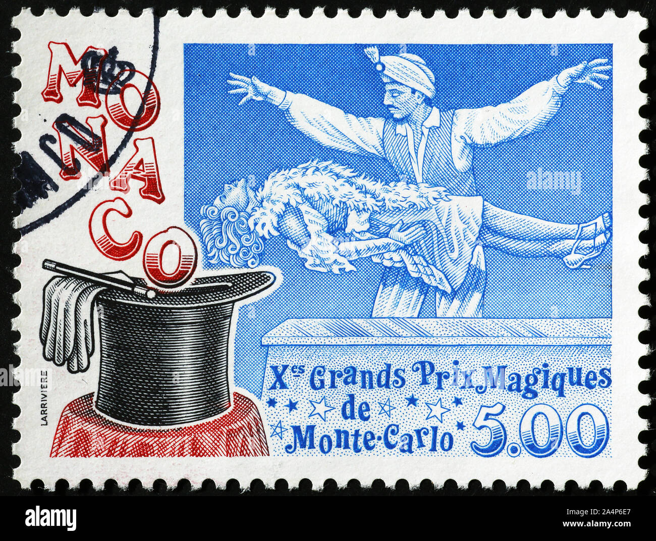 Magician in action on postage stamp of Monaco Stock Photo