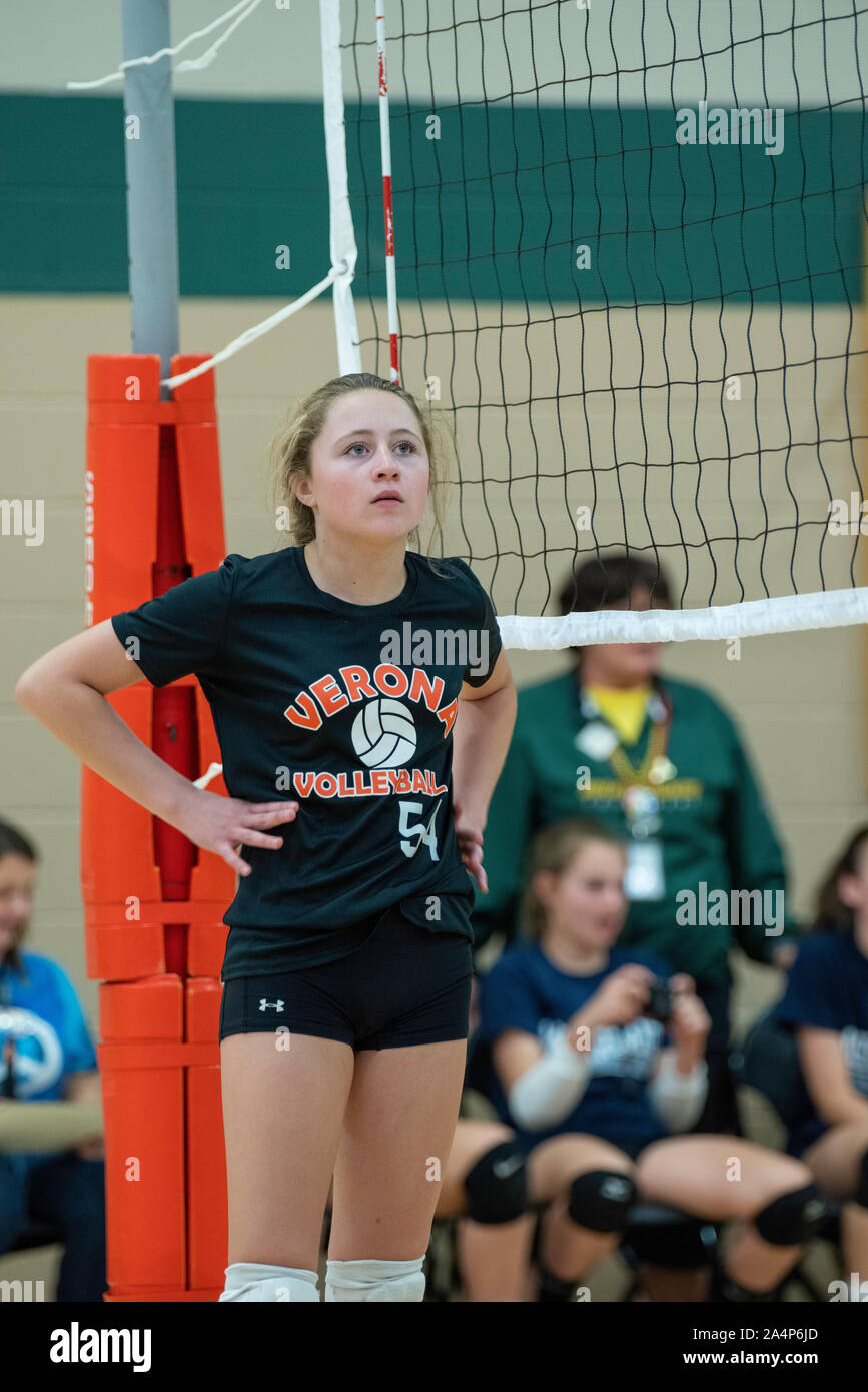 Middle school girl playing volleyball hires stock photography and