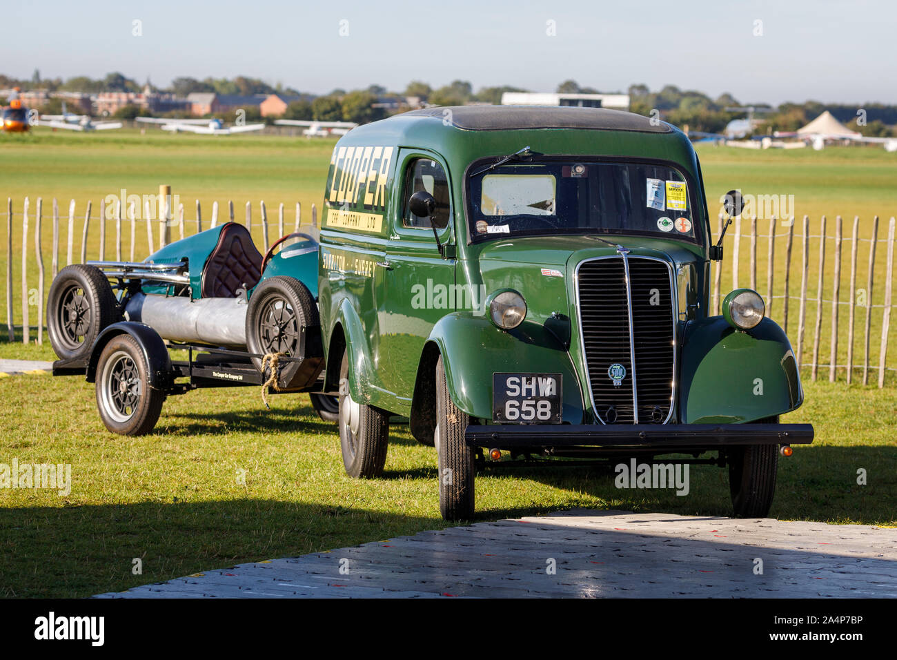 1954 Fordson E83W with trailer carrying a Cooper-Jap at the 2019 Goodwood Revival, Sussex, UK. Stock Photo