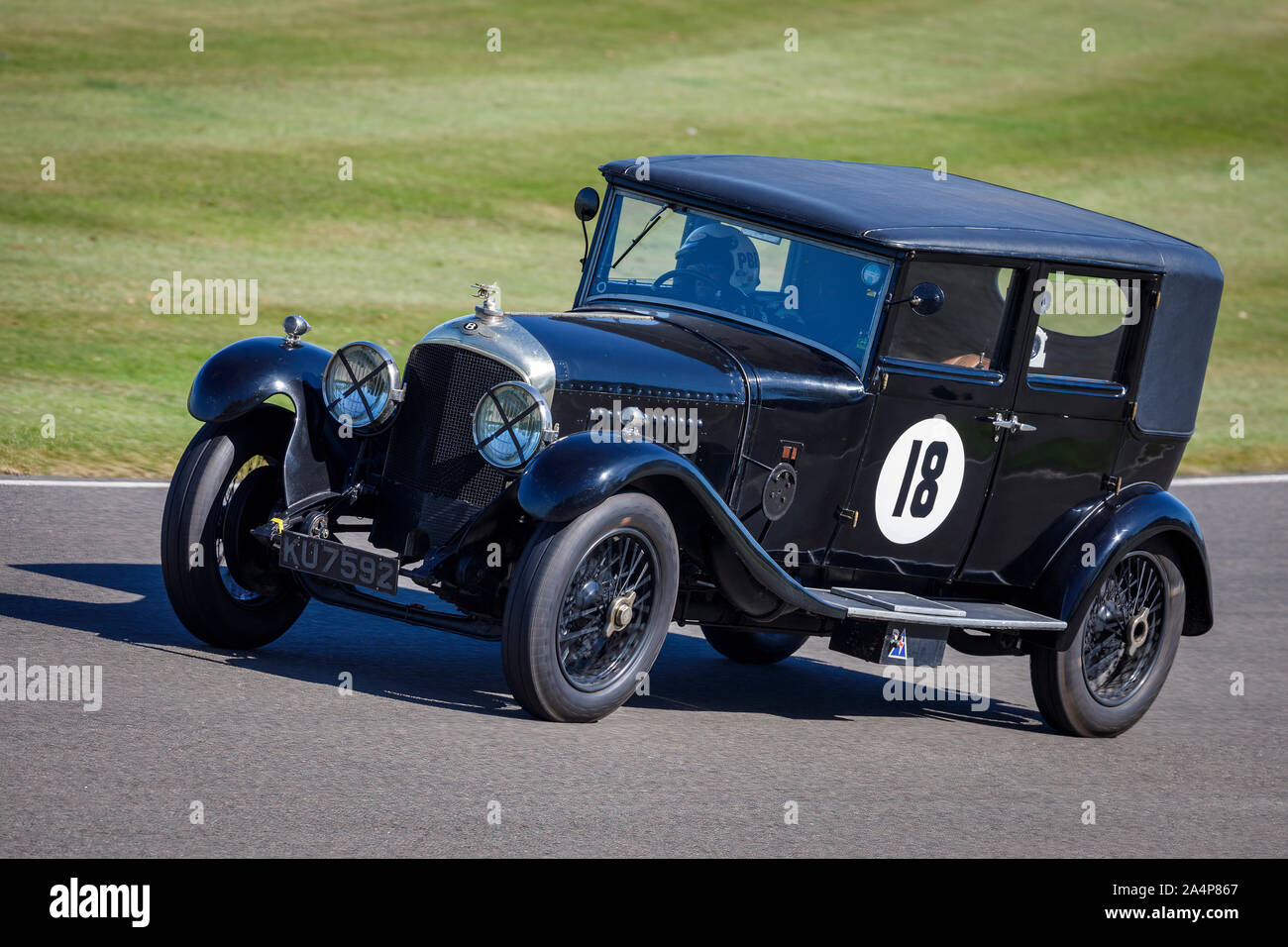 1926 Bentley 4.5 litre Parkward Saloon dueing the Brooklands Trophy race with driver Rowan Atkinson at the 2019 Goodwood Revival, Sussex, UK. Stock Photo