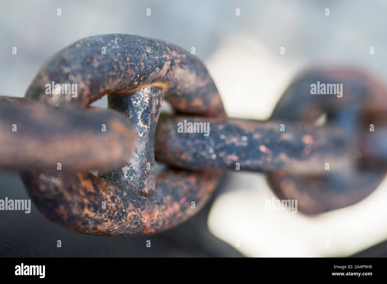 Old metal chains near the port. Stretched chains. Close up. Stock Photo