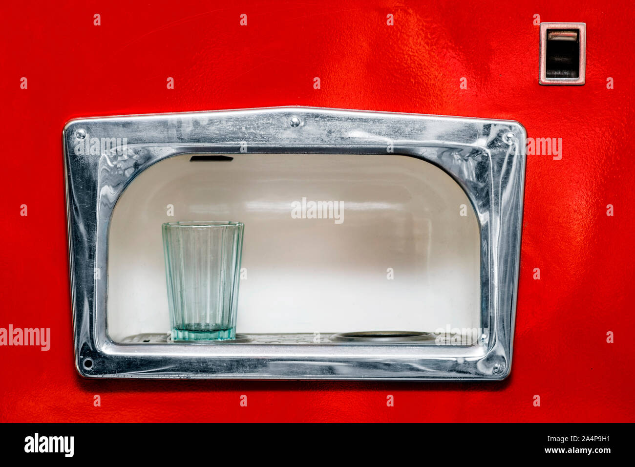Detail of old vintage automat for making soda. Beverage vending machines selling. Red soda vending machine. Stock Photo
