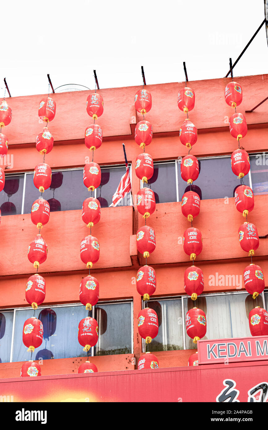 traditional red paper lanterns hanging from restaurant in a kuala