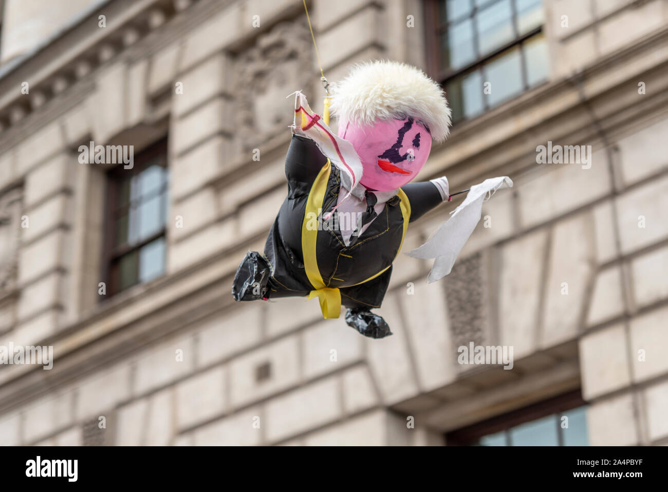 Boris Johnson effigy hanging from cord cable at Brexit protests prior to the State opening of Parliament 2019, Westminster, London, UK Stock Photo