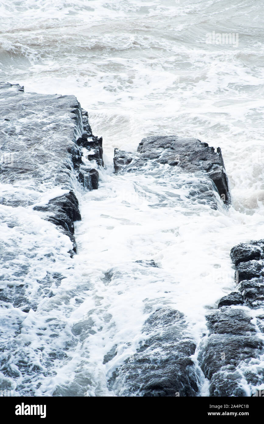 Rocky shore in stormy weather, seas waves Stock Photo - Alamy