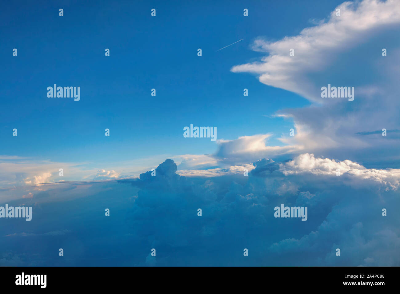 flight through white clouds and blue sky Stock Photo - Alamy