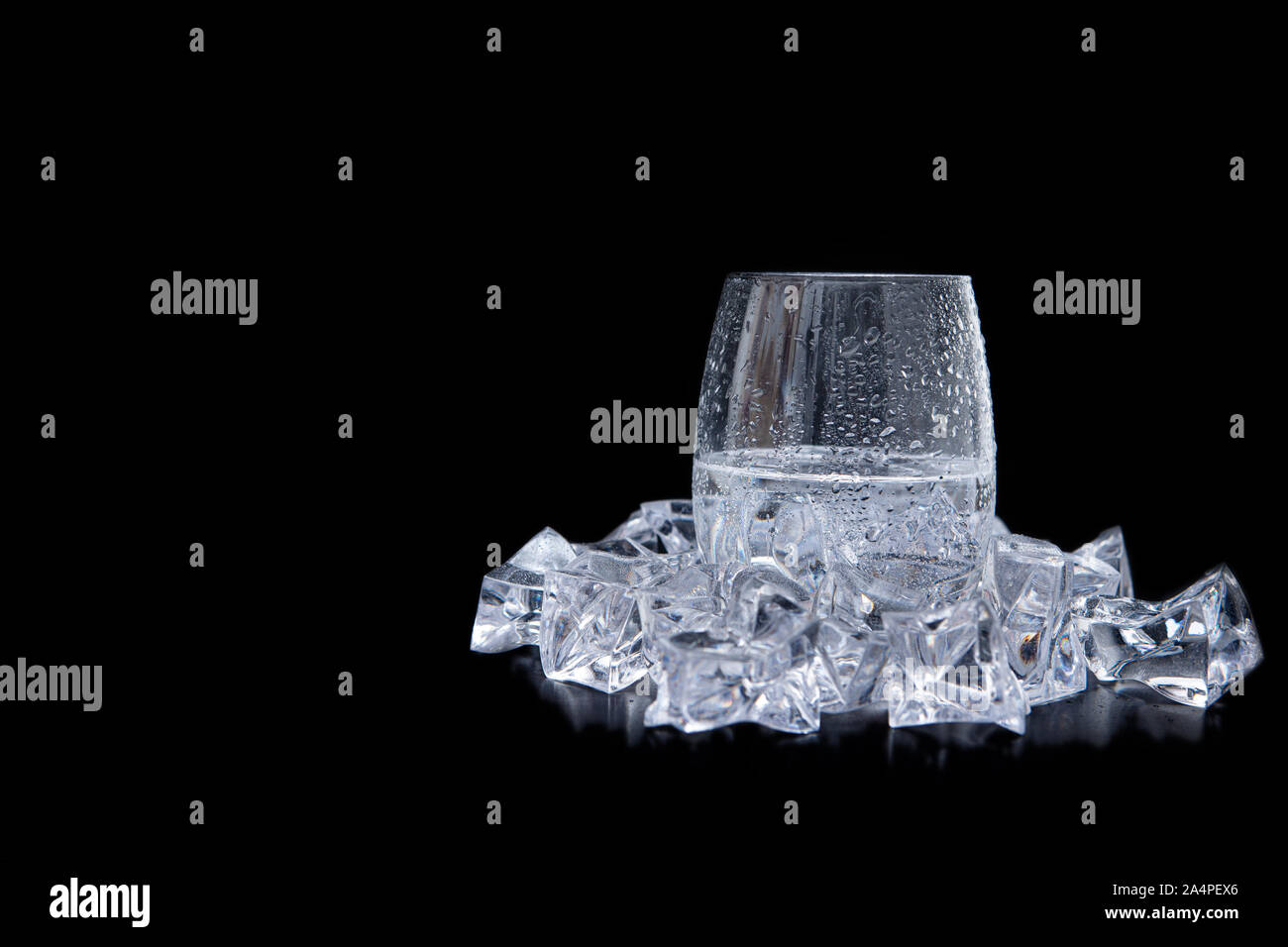 glass of water with ice and bubbles on black background Stock Photo - Alamy
