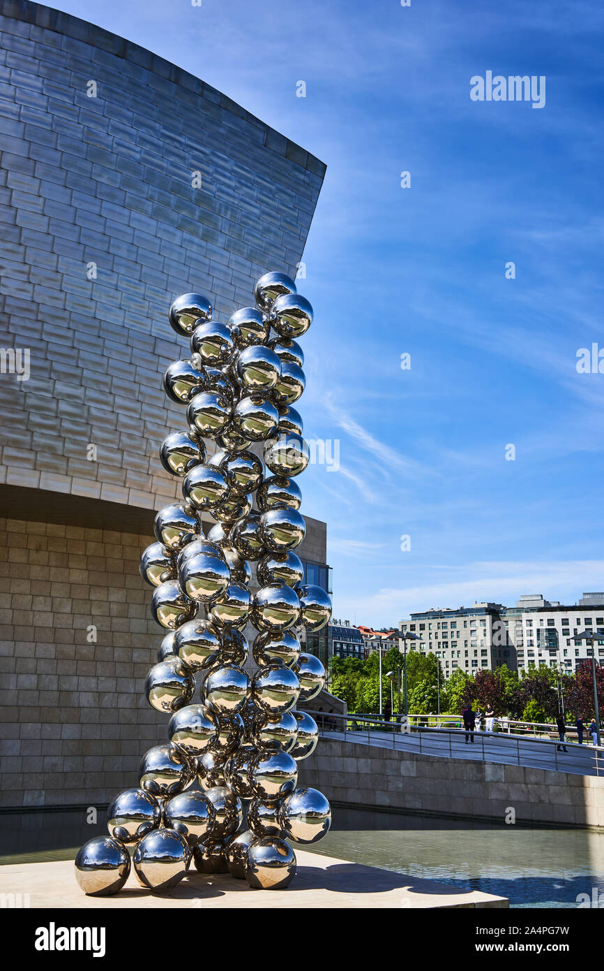 Anish Kapoor, tall tree and the eye sculpture located outside the  Guggenheim museum in Bilbao, Spain Stock Photo - Alamy