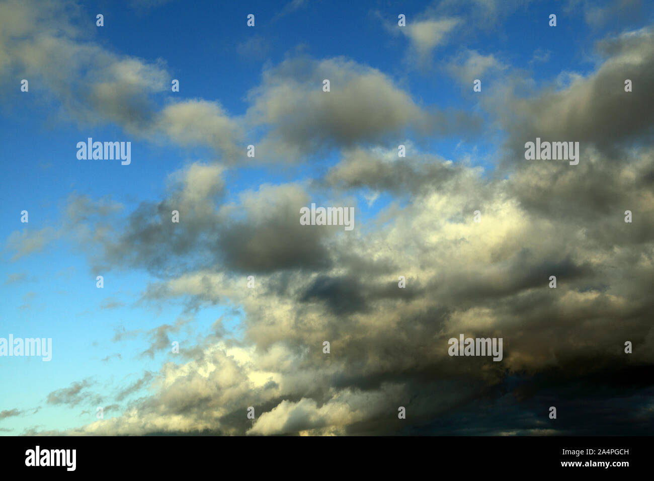 Blue sky, white, grey, dark cloud, clouds, meteorology Stock Photo