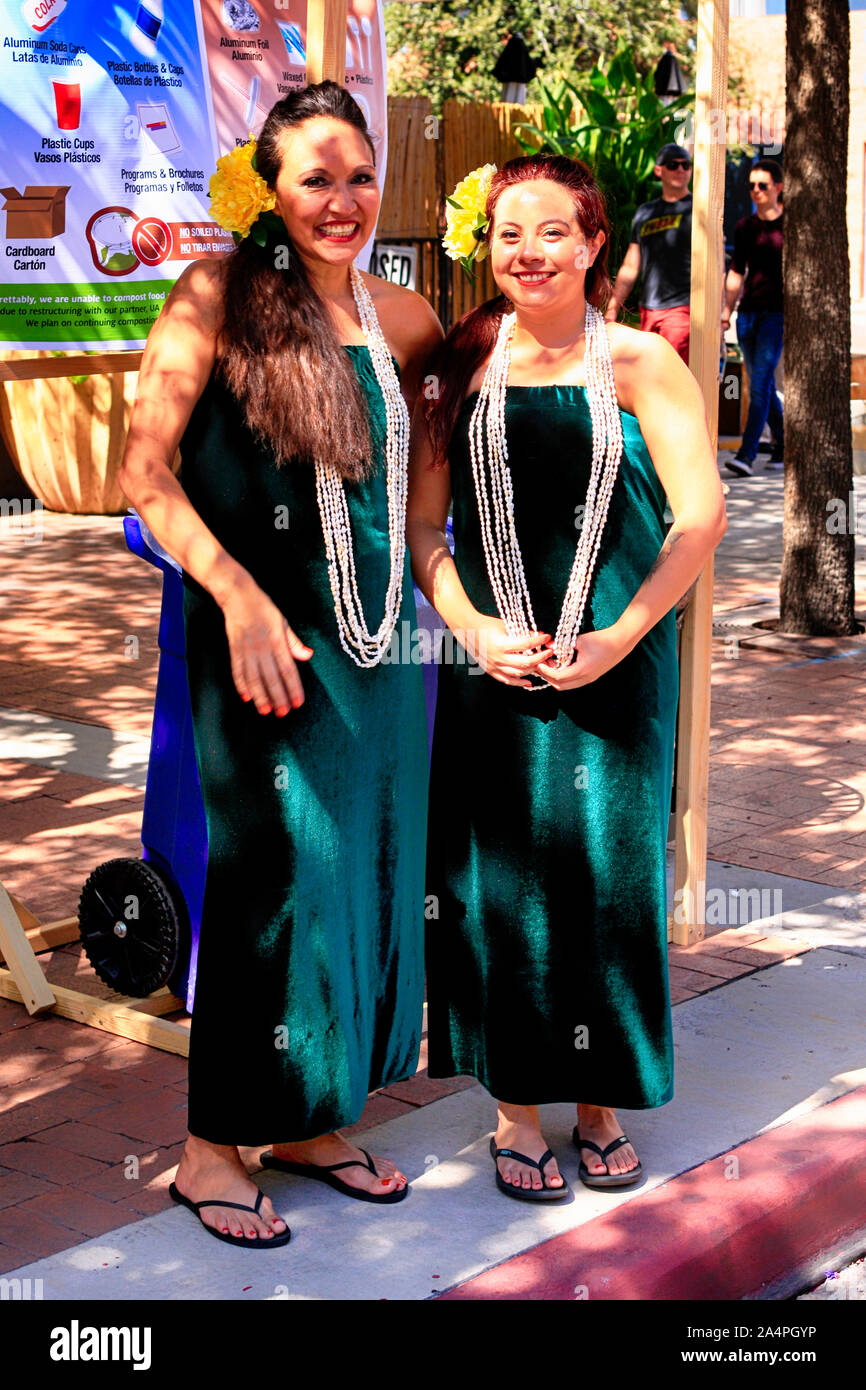 Women dressed in Polyenesian dresses with string of pearls at the Tucson Meet Yourself Folk Festival Stock Photo