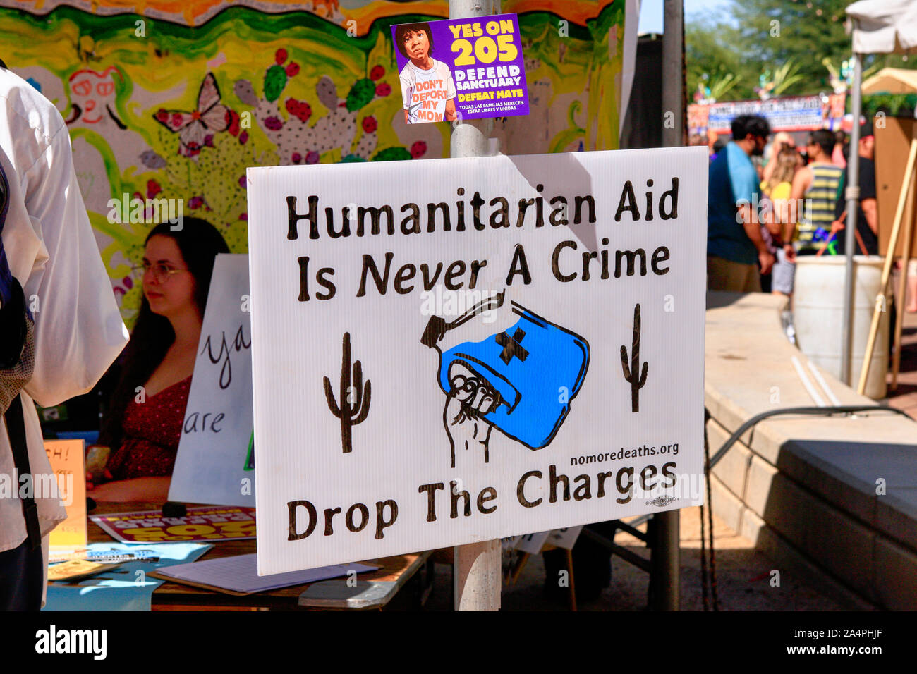 Humanitarian Aid Is Never A Crime banner and a Vote 205 in favor of Tucson becoming a sanctuary city Stock Photo