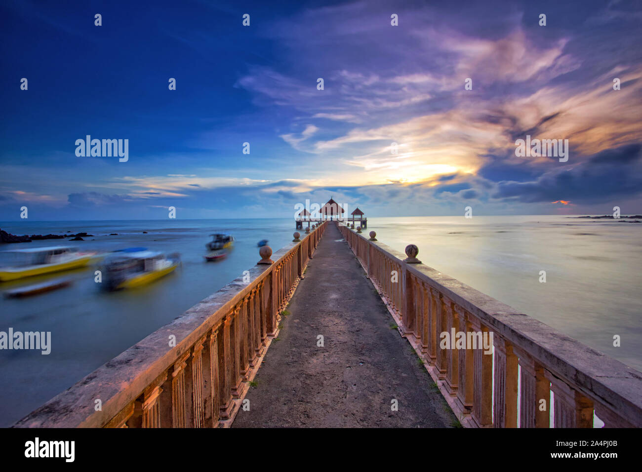 A long exposure of a stone jetty leading into the sea during monsun season, Tanjung Balau,Johore,Malaysia Stock Photo