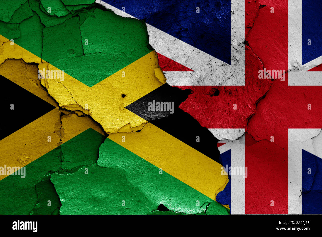 flags of Jamaica and UK painted on cracked wall Stock Photo