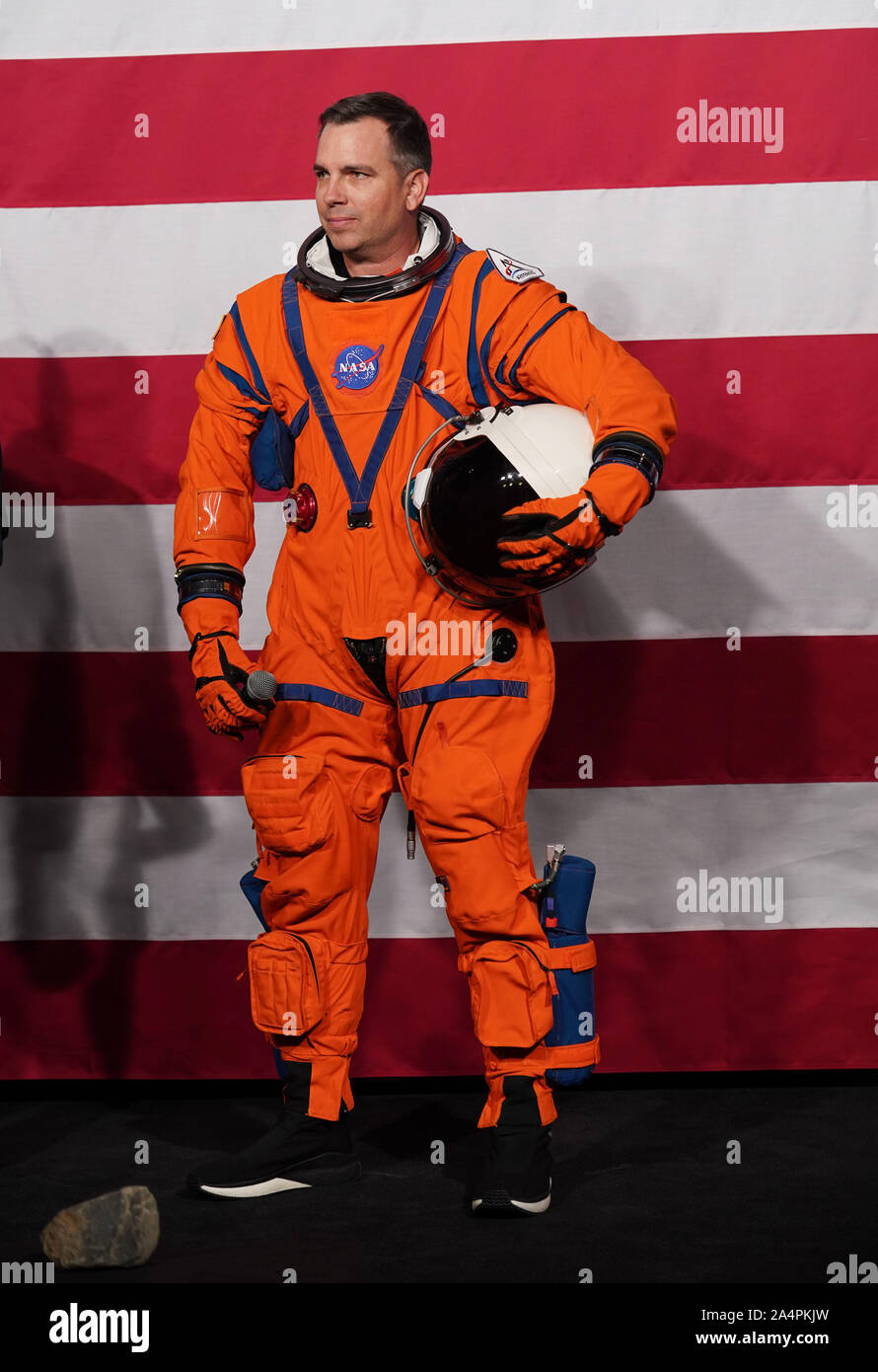 Washington, USA. 15th Oct, 2019. Lead engineer Dustin Gohmert dispays the Orion Crew Survival System spacesuit at NASA headquarters in Washington, DC, the United States, on Oct. 15, 2019. The U.S. space agency NASA unveiled on Tuesday the next-generation spacesuits to be used in its Artemis program that will send the first woman and next man to the Lunar South Pole by 2024. Credit: Liu Jie/Xinhua/Alamy Live News Stock Photo