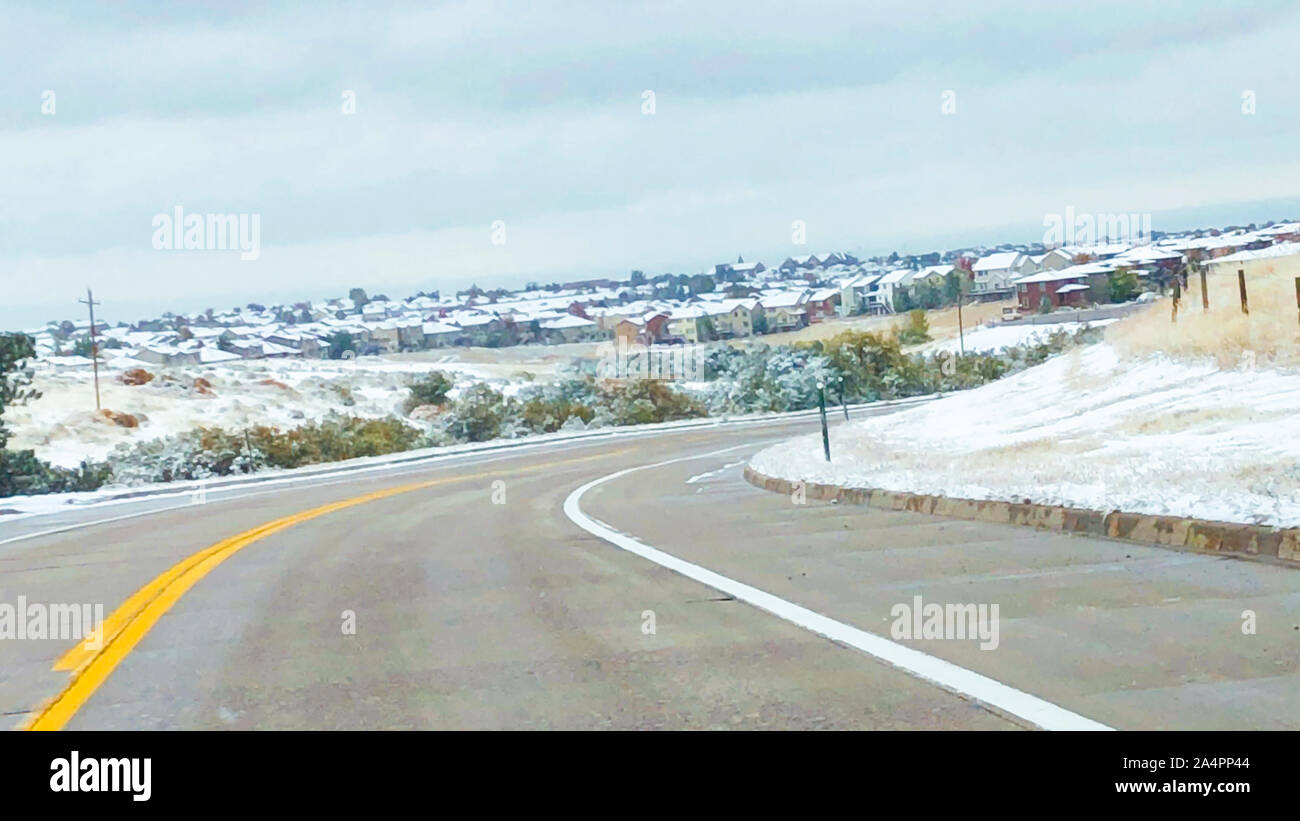 Driving in typical North American suburbs after the first snowstorm of ...