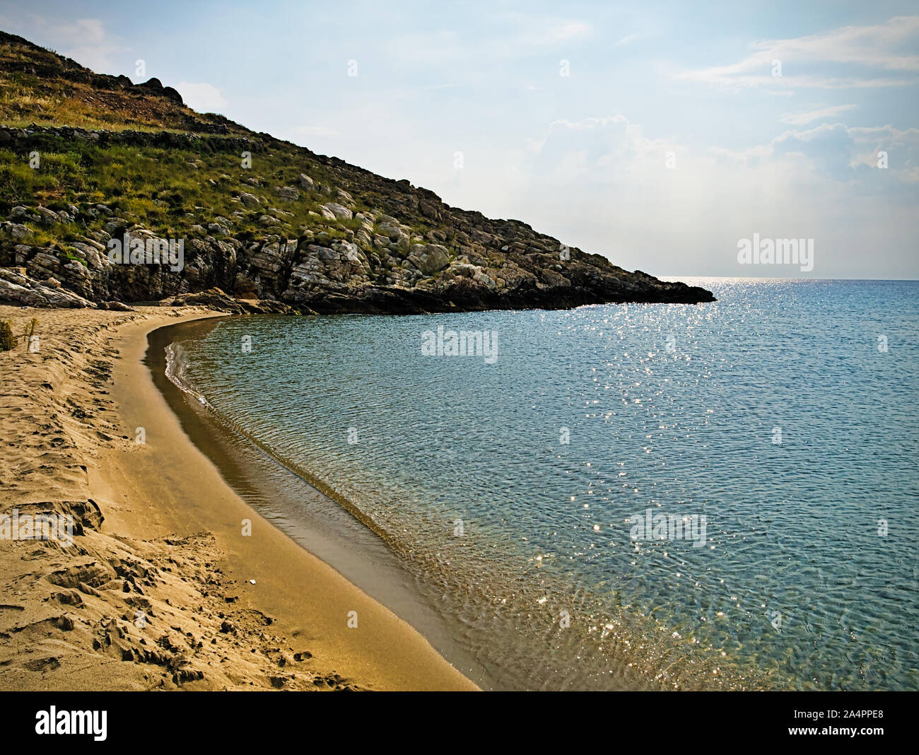 Beautiful sandy beach and overcast sky. Marmari in  Laconia, Greece. Stock Photo