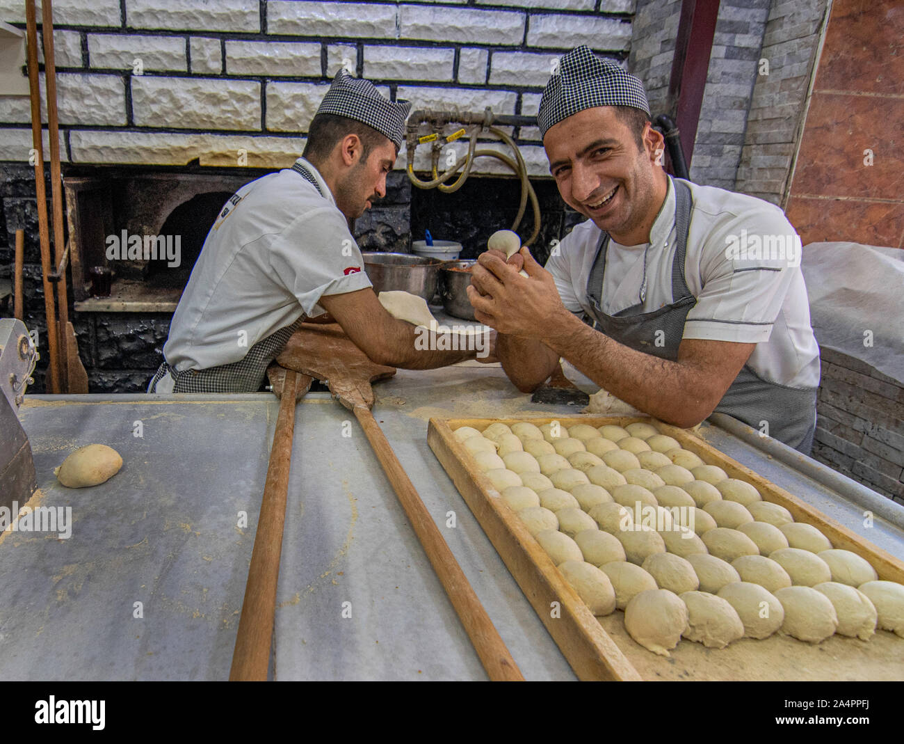 Chef in Istanbul Restaurant, Ortaklar Kebap Lahmacun, shaping dough. Stock Photo