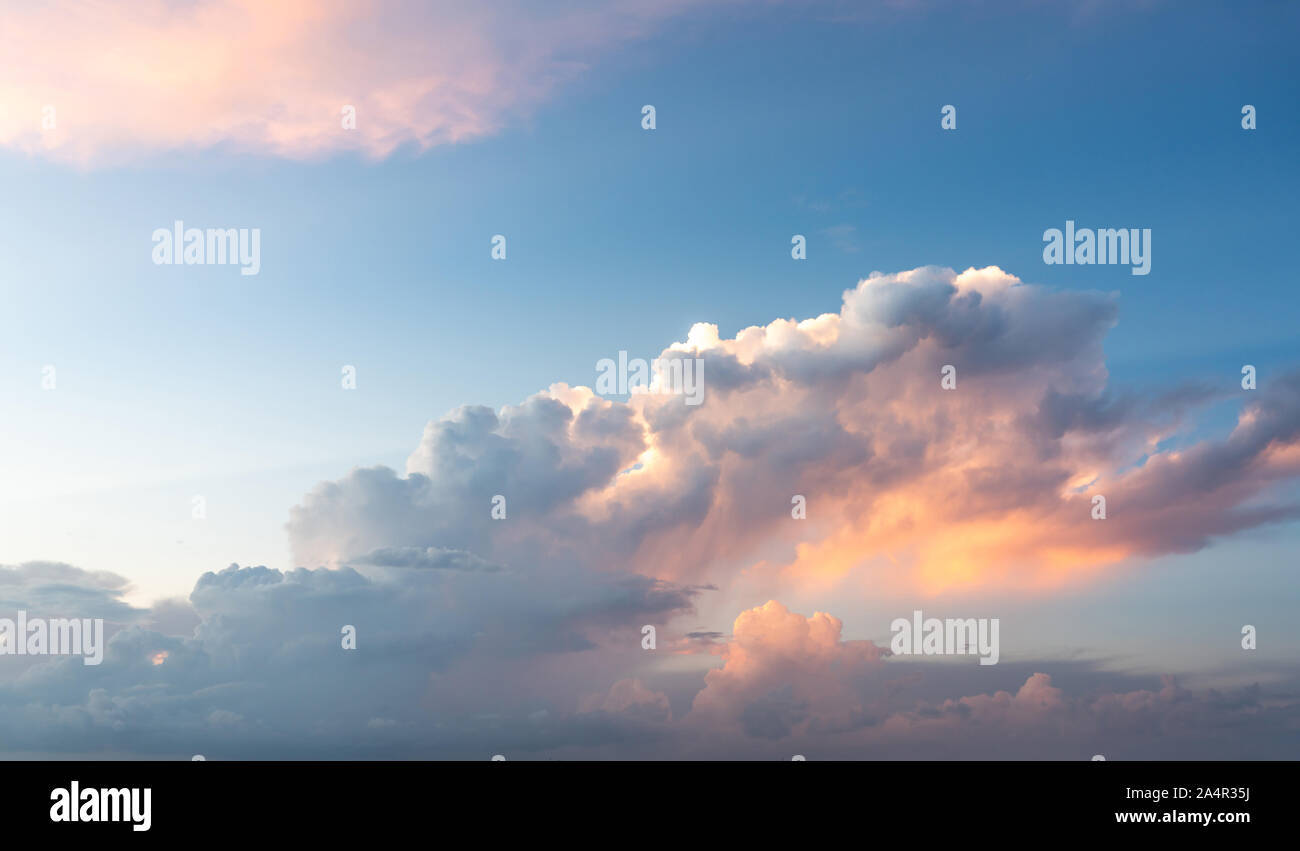 Blue sunset sky with many nice white clouds Stock Photo