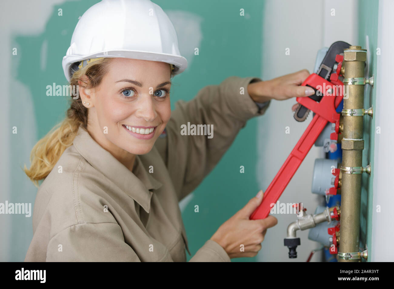 Woman builder wearing helmet hi-res stock photography and images - Alamy