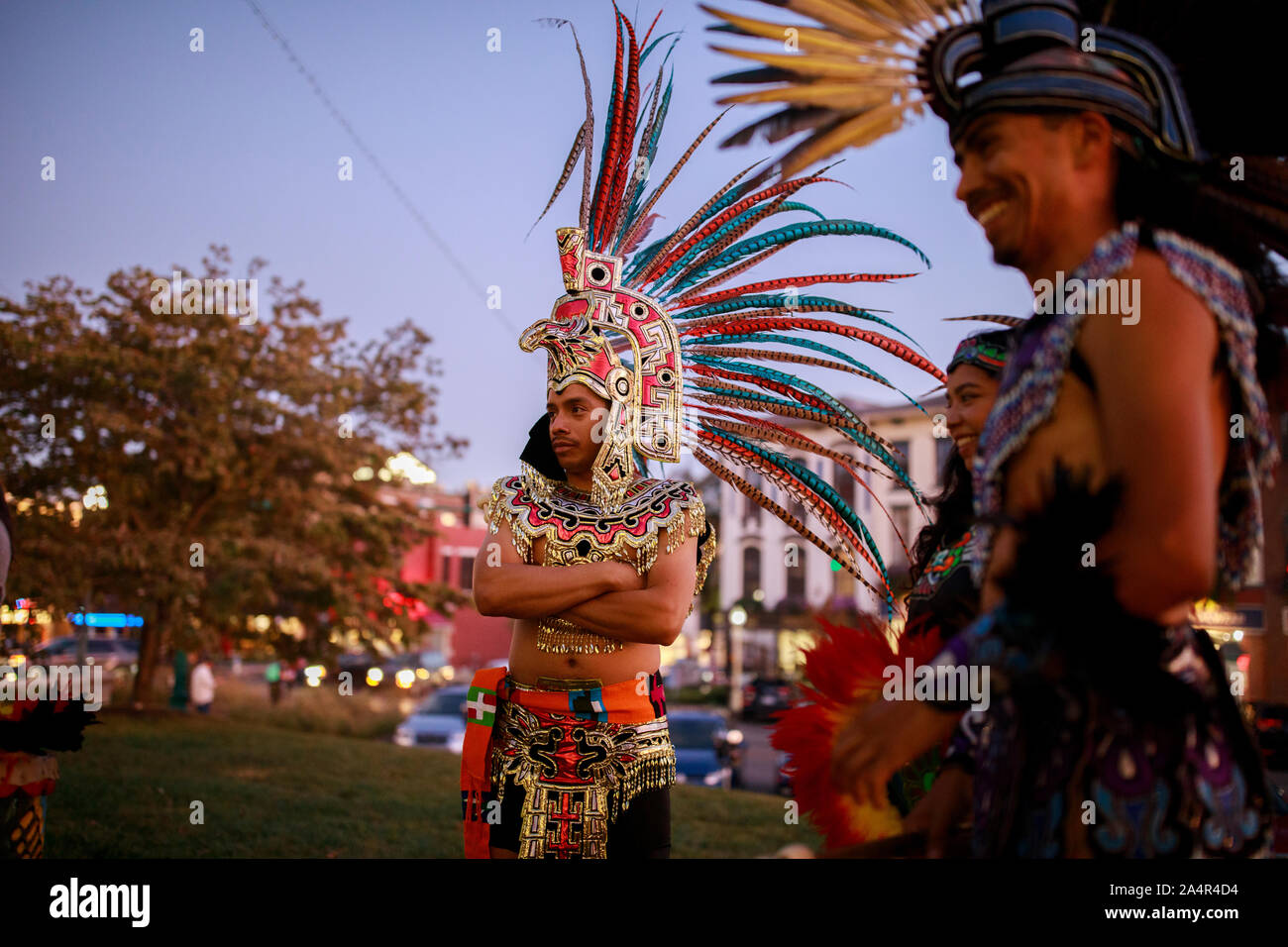 Bloomington, United States. 14th Oct, 2019. Mexica (Aztec) dancers in costumes at the Monroe County Courthouse after performing during Indigenous Peoples Day in Bloomington.A resolution passed by the Bloomington City Council officially puts Indigenous People's Day on the calendar as a holiday every second Monday of October. Credit: SOPA Images Limited/Alamy Live News Stock Photo