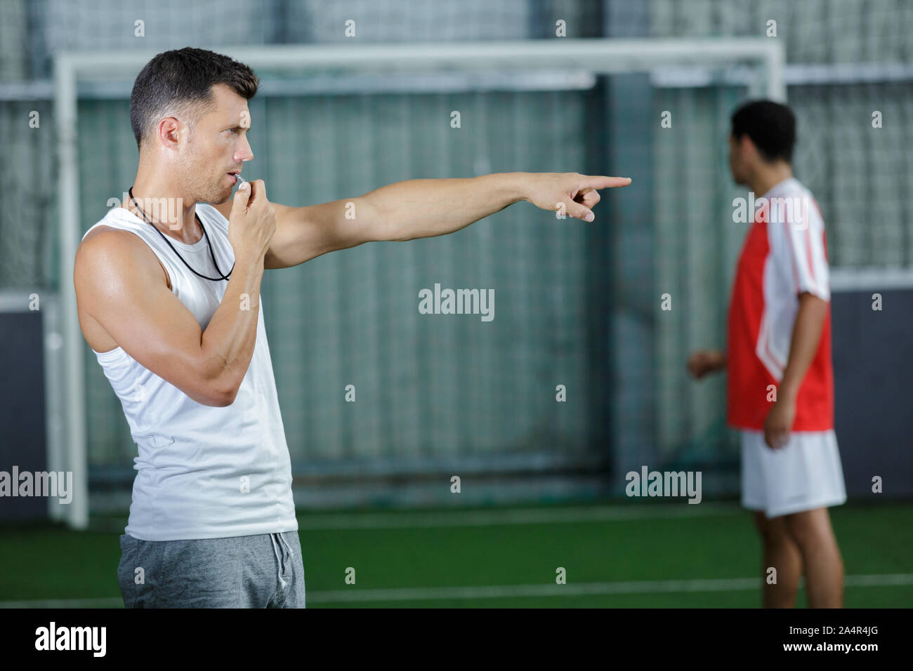 the referee blows the whistle Stock Photo Alamy