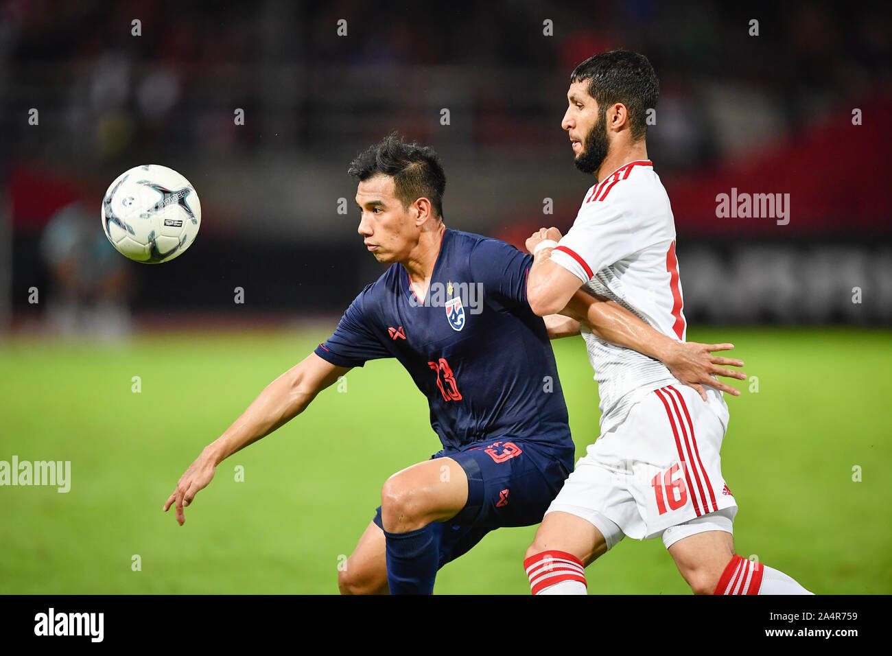 Pathum Thani Thailand 15th Oct 19 Nitipong Selanon Of Thailand No 13 Competes For The Ball With Player Of United Arab Emirates Uae During The Fifa World Cup Asian Second Qualifier Match Between Thailand