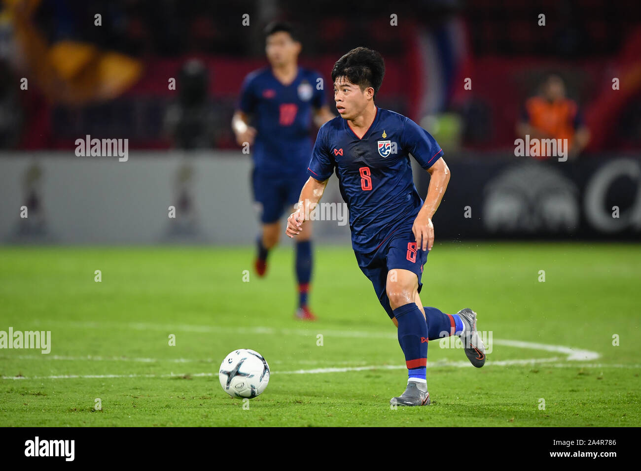 Pathum Thani, Thailand. 15th Oct, 2019. Ekanit Panya of Thailand (No.8) competes for the ball with player of United Arab Emirates(UAE) during the FIFA World Cup Asian second qualifier match between Thailand and United Arab Emirates(UAE) at Thammasat Stadium. on 15th Oct, 2019 (Photo by Amphol Thongmueangluang/Pacific Press) Credit: Pacific Press Agency/Alamy Live News Stock Photo