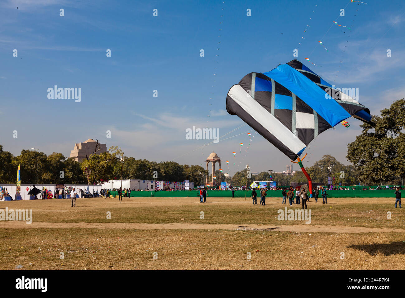 DELHI, INDIA, People flying kites at the India Gate lawns during the