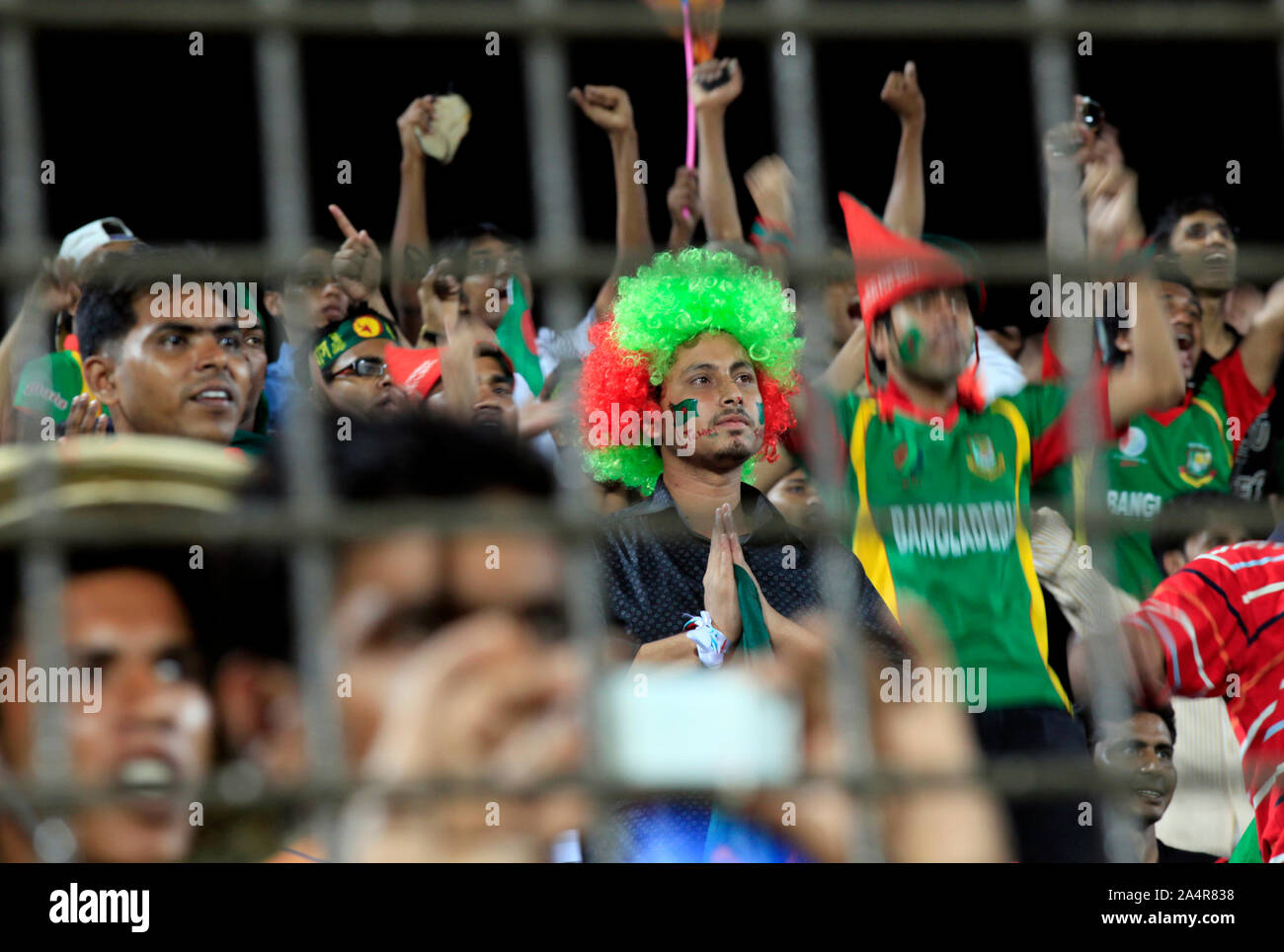 Bangladeshi cricket fans cheer for their team, at the England versus Bangladesh match of the ICC Cricket World Cup 2011, in Zahur Ahmed Chowdhury Stadium, Chittagong, Bangladesh. March 11, 2011. Stock Photo