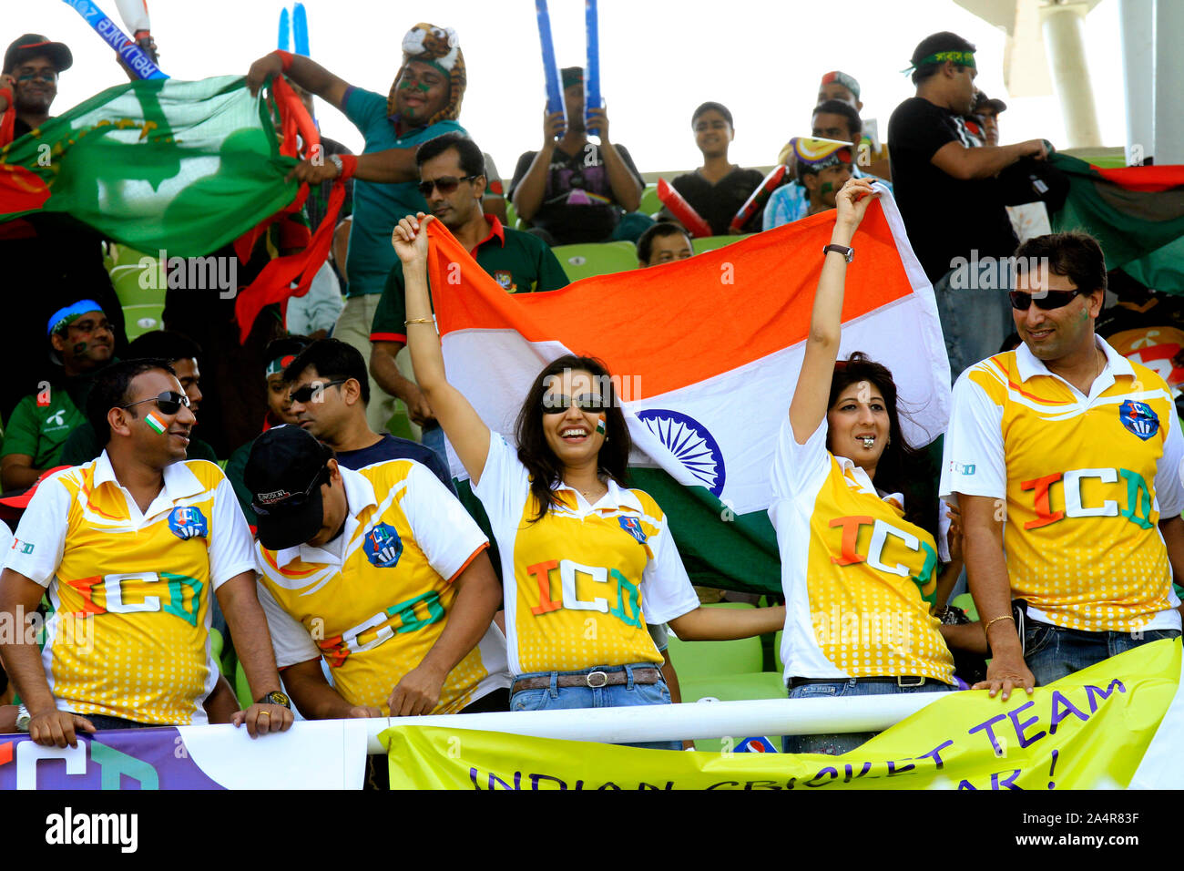 Indian supporters wave their country’s flag during the opening match of the 10th ICC Cricket World Cup, in Sher-e-Bangla National Stadium, on 19th February, 2011.  Mirpur, Dhaka, Bangladesh. Stock Photo