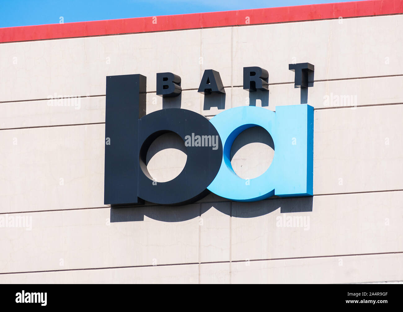 BART sign on the facade of parking garage at West Dublin - Pleasanton station of Bay Area Rapid Transit Stock Photo