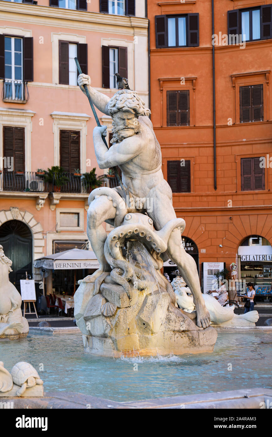 Statue of Neptune  - the god of freshwater and the sea - in the middle of Fontana del Nettuno in Piazza Navona, Rome, Italy Stock Photo