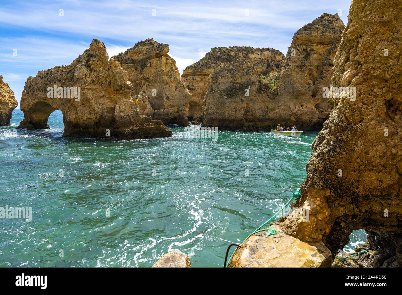 The golden cliffs and turquoise ocean waters at Ponta da Piedade, one of the most iconic landscape of Algarve, Portugal Stock Photo