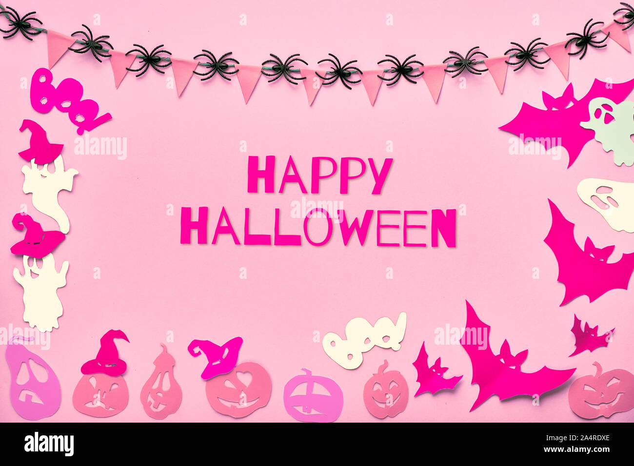 Creative Halloween flat lay background on pink paper with text "Happy  Halloween". Paper cut decorations: bats, ghosts and jack lantern pumpkins,  garla Stock Photo - Alamy