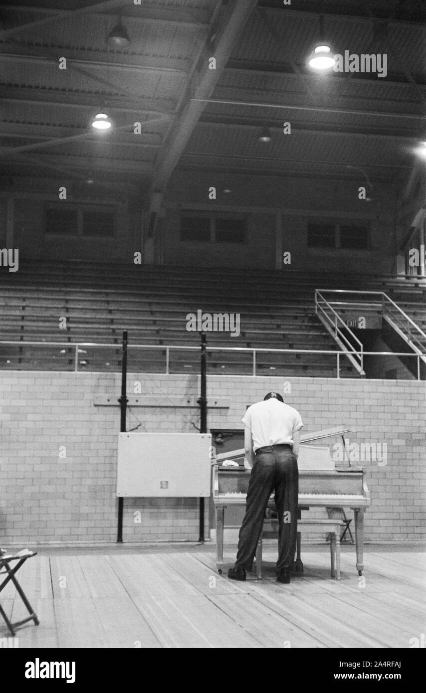 Elvis Presley preparing for a performance at the University of Dayton Fieldhouse, May 27, 1956. Stock Photo