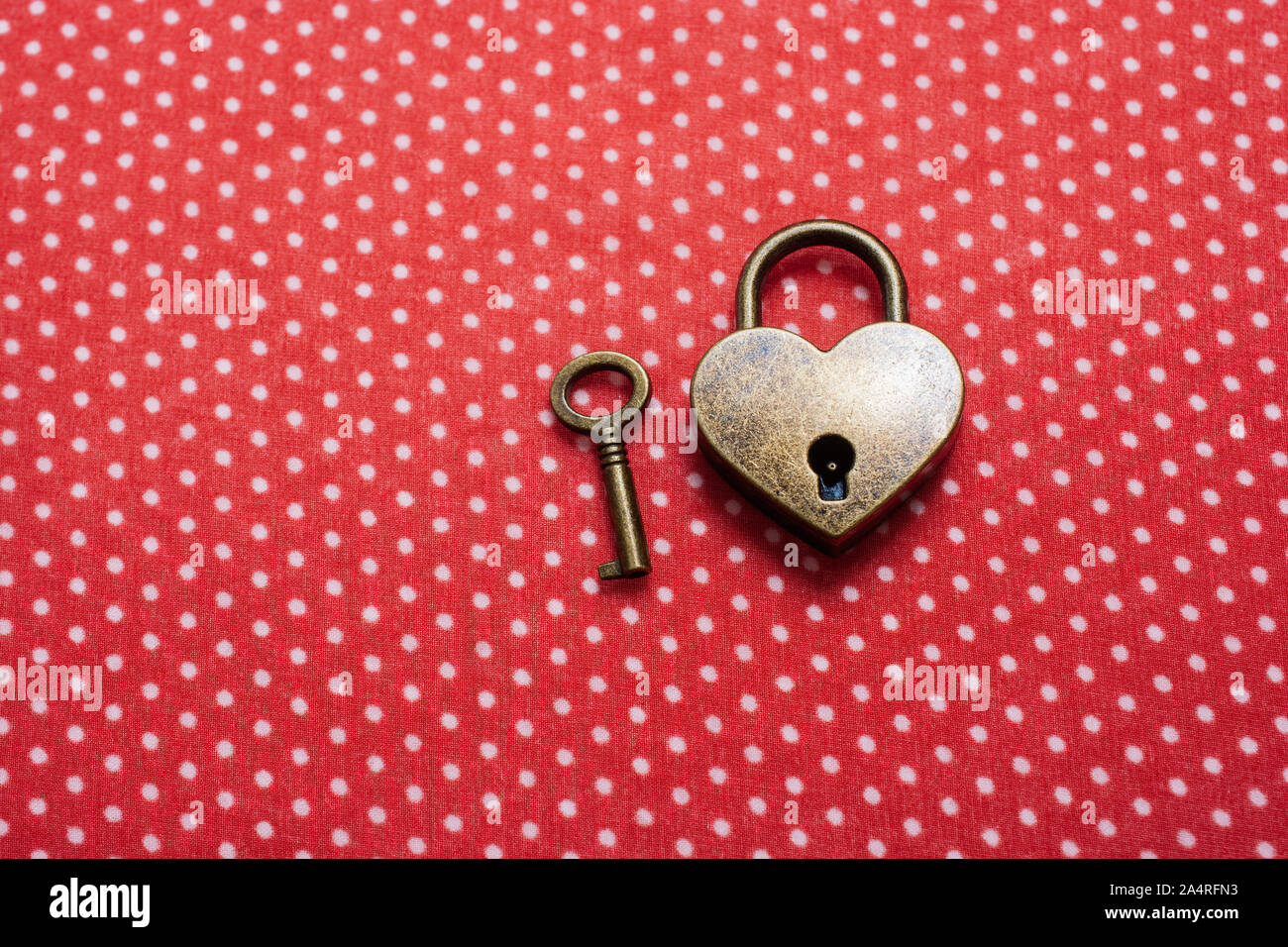 Heart shaped lock and key on an abstract background Stock Photo - Alamy