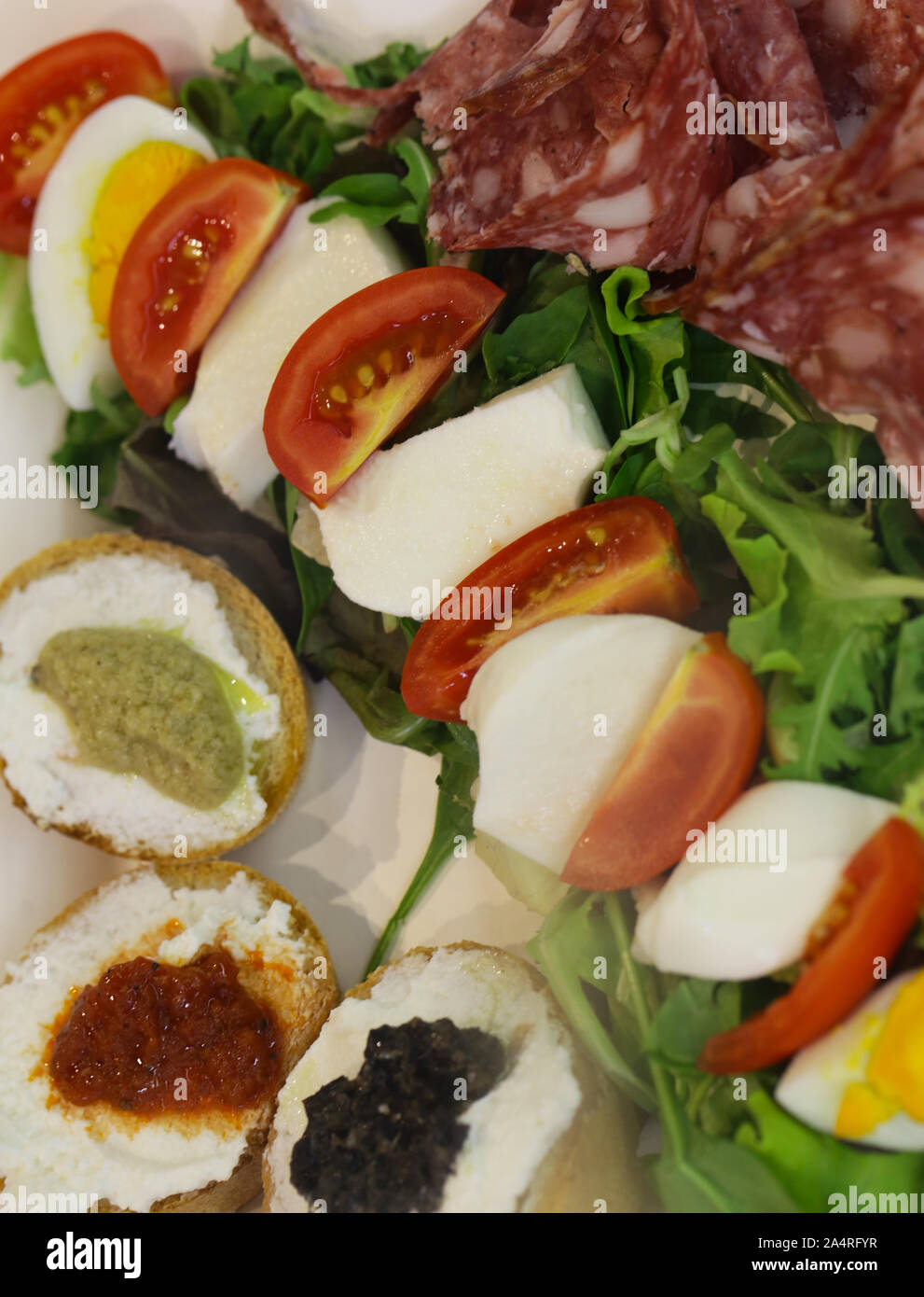 italian appetizer antipasti, cheese, ham and fruit Stock Photo Alamy