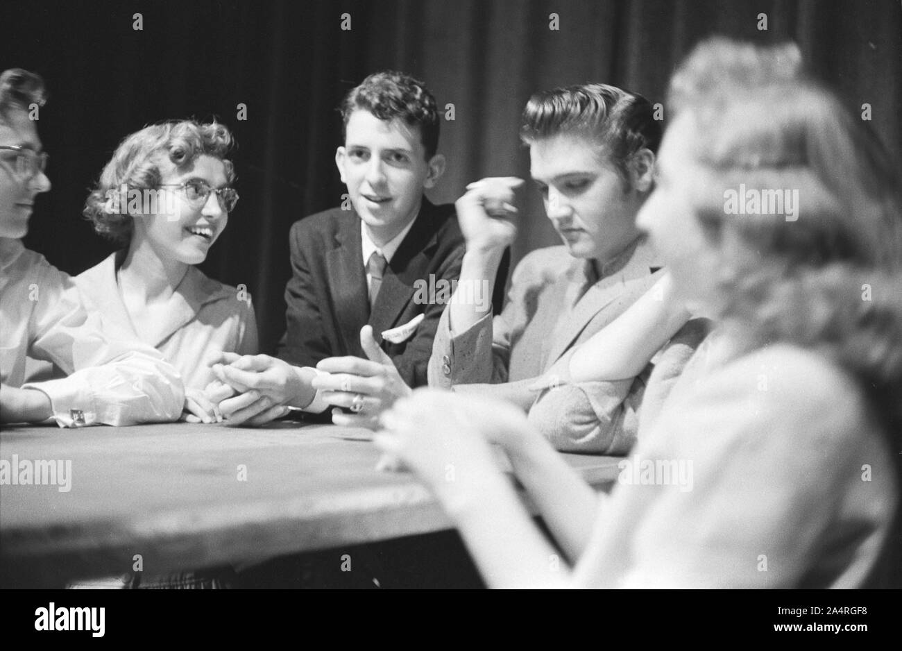 Elvis Presley signing autographs at the Fox Theater, Detroit, Michigan, May 25, 1956. Stock Photo