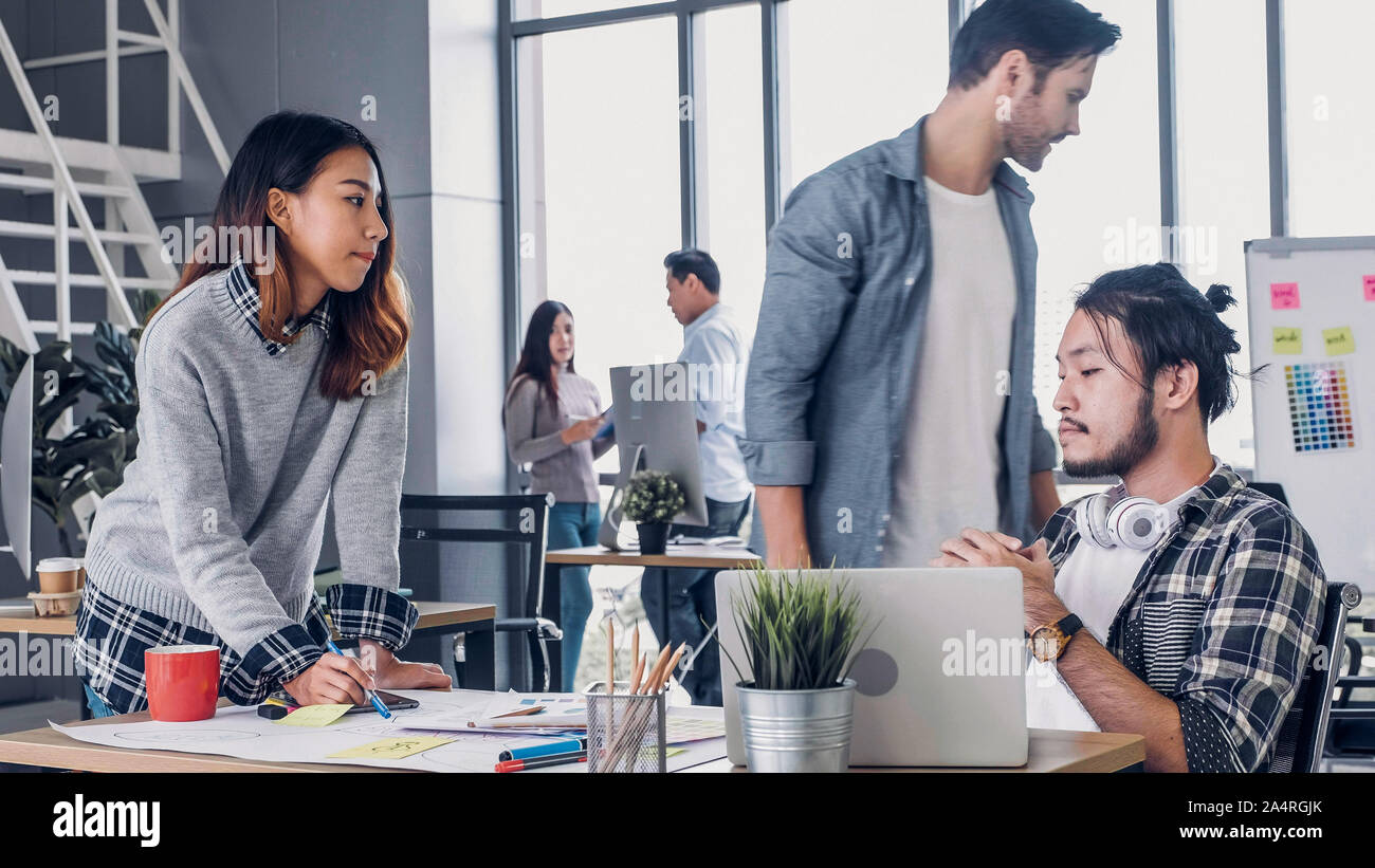 creative designer team argument at casual meeting table and walk out from meeting in modern office.tea,m conflict concept Stock Photo