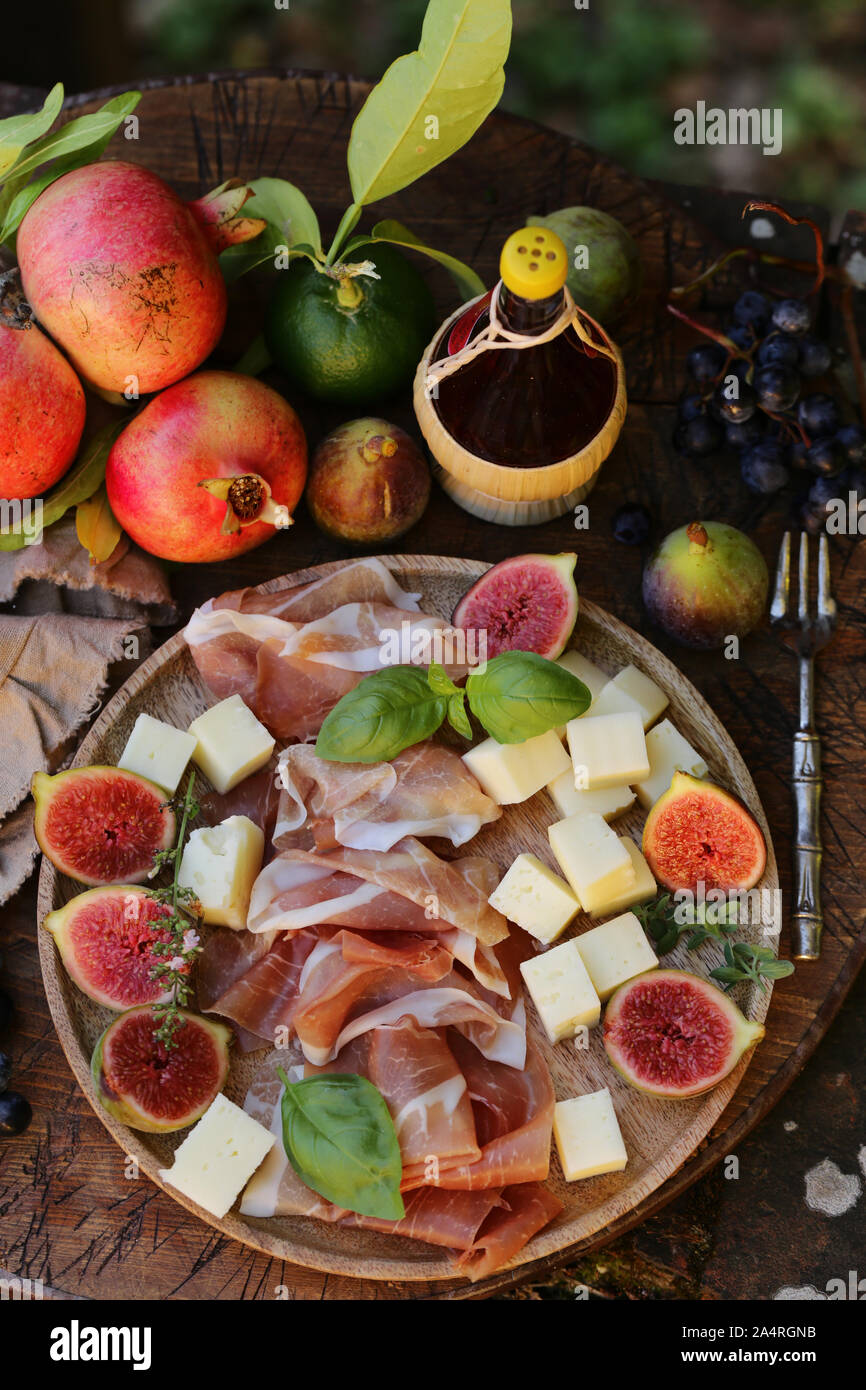 italian appetizer antipasti, cheese, ham and fruit Stock Photo Alamy