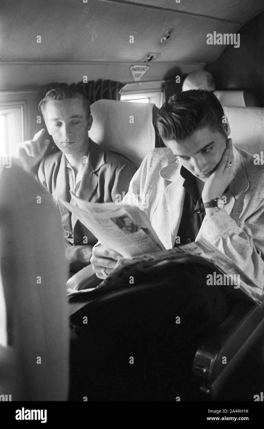 Elvis Presley and his cousin Gene Smith on a bus travelling on tour. The exact date is unknown, but it is probably May 27, 1956 Stock Photo